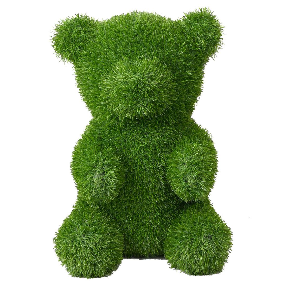 Orso decorativo seduto in prato sintetico verde 30x50 cm.