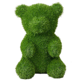 Orso decorativo seduto in prato sintetico verde 30x50 cm.
