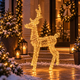Renna luminosa dorata H110 cm con micro LED ambientata davanti a un ingresso natalizio