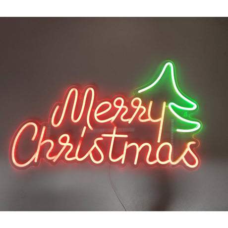 Decorazione luminosa natalizia con scritta rossa Merry Christmas e albero verde stilizzato in stile neon LED.
