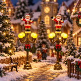 Set 2 lampioni LED con Babbo Natale h 14,2 cm per villaggio natalizio