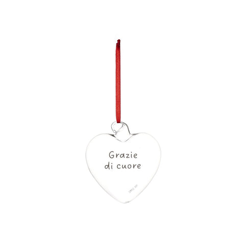 Pallina a forma di cuore in vetro trasparente con cordino rosso e scritta "grazie di cuore".