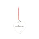 Pallina a forma di cuore in vetro trasparente con cordino rosso e scritta "sorridi sempre".