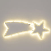 Decorazione natalizia a forma di stella cometa illuminata con luce LED bianco caldo, accesa su sfondo grigio.