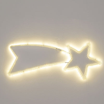 Decorazione natalizia a forma di stella cometa illuminata con luce LED bianco caldo, accesa su sfondo grigio.