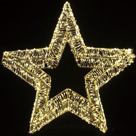 Decorazione natalizia a forma di stella dorata illuminata da micro LED bianco caldo su sfondo nero misura 40 cm.