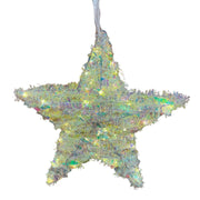 Decorazione natalizia a forma di stella iridescente illuminata da luci LED bianco caldo.