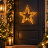 Stella natalizia riccio oro 58 cm illuminata con micro LED, ambientata sulla porta