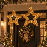 Stelle natalizie riccio oro 50 e 58 cm illuminate con micro LED, ambientate all’ingresso