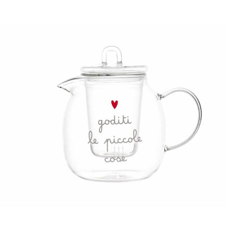Teiera in vetro trasparente con filtro interno e scritta decorativa “goditi le piccole cose” accompagnata da un cuore rosso.