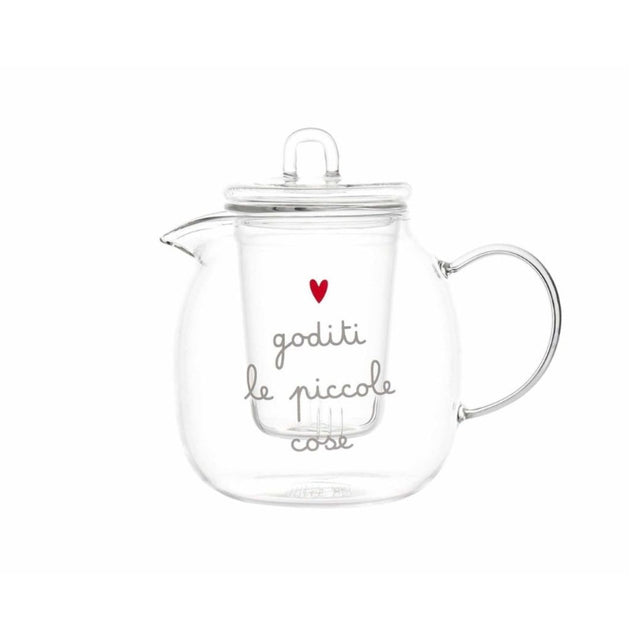 Teiera in vetro trasparente con filtro interno e scritta decorativa “goditi le piccole cose” accompagnata da un cuore rosso.