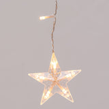 Dettaglio della stella della tenda luminosa con stelle bianco caldo su sfondo grigio. 