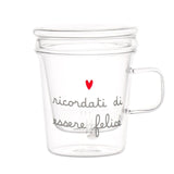 Tisaniera in vetro con filtro e coperchio decorata con scritta "ricordati di essere felice" e cuoricino rosso.