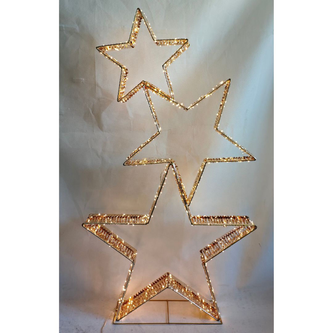 Decorazione natalizia luminosa con tre stelle dorate intrecciate illuminate da micro LED bianco caldo.