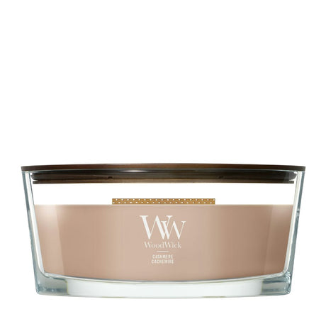 Candela WoodWick Cashmere Ellipse in vaso di vetro con coperchio in legno.