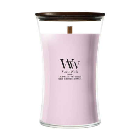 Candela WoodWick Cherry Blossom & Vanilla grande in vaso di vetro con coperchio in legno.