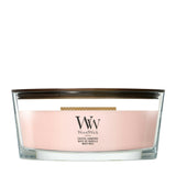 Candela WoodWick Coastal Sunberry Ellipse in vaso di vetro con coperchio in legno.