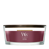 Candela WoodWick Dark Cherry Ellipse in vaso di vetro con coperchio in legno.