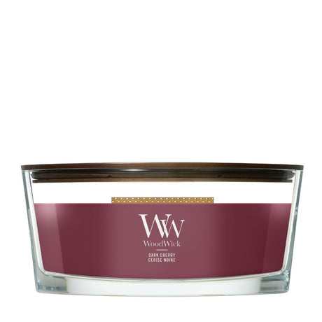 Candela WoodWick Dark Cherry Ellipse in vaso di vetro con coperchio in legno.