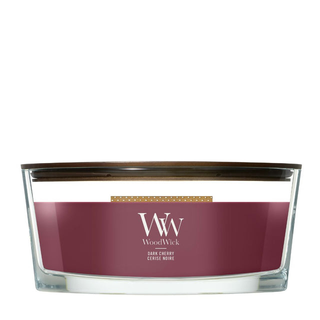 Candela WoodWick Dark Cherry Ellipse in vaso di vetro con coperchio in legno.