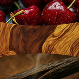 Collage con ciliegie scure, venature di legno e fumo che richiamano la profumazione della candela.