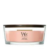 Candela WoodWick Manuka Nectar Ellipse in vaso di vetro con coperchio in legno.