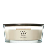 Candela WoodWick Patchouli Crème Ellipse in vaso di vetro con coperchio in legno.