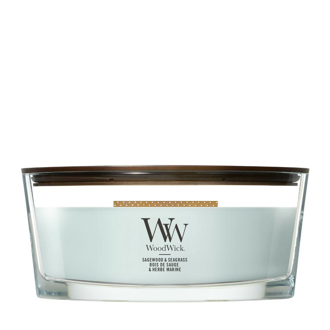 Candela WoodWick Sagewood & Seagrass Ellipse in vaso di vetro con coperchio in legno.