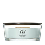 Candela WoodWick Sagewood & Seagrass Ellipse in vaso di vetro con coperchio in legno.