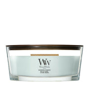 Candela WoodWick Sagewood & Seagrass Ellipse in vaso di vetro con coperchio in legno.