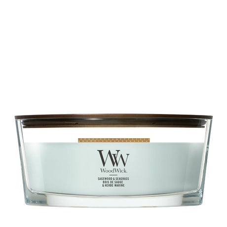 Candela WoodWick Sagewood & Seagrass Ellipse in vaso di vetro con coperchio in legno.