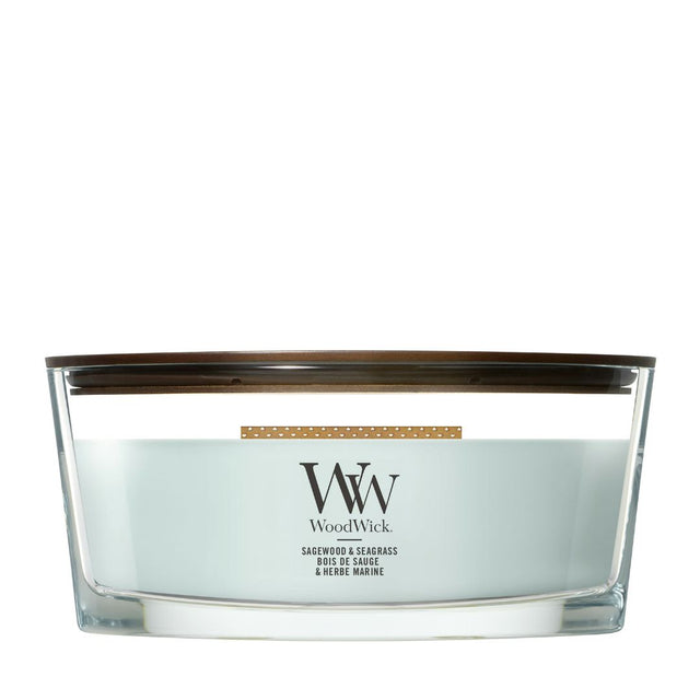Candela WoodWick Sagewood & Seagrass Ellipse in vaso di vetro con coperchio in legno.