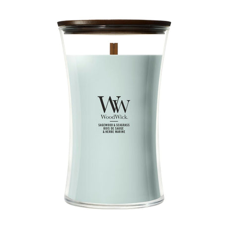 Candela WoodWick Sagewood & Seagrass grande in vaso di vetro con coperchio in legno.