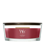 Candela WoodWick Spiced Blackberry Ellipse in vaso di vetro con coperchio in legno.