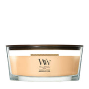 Candela WoodWick Tangerine & Citron ellipse in vaso di vetro con coperchio in legno.