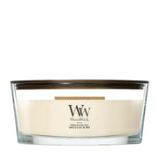 Candela WoodWick Vanilla & Sea Salt Ellipse in vaso di vetro con coperchio in legno.