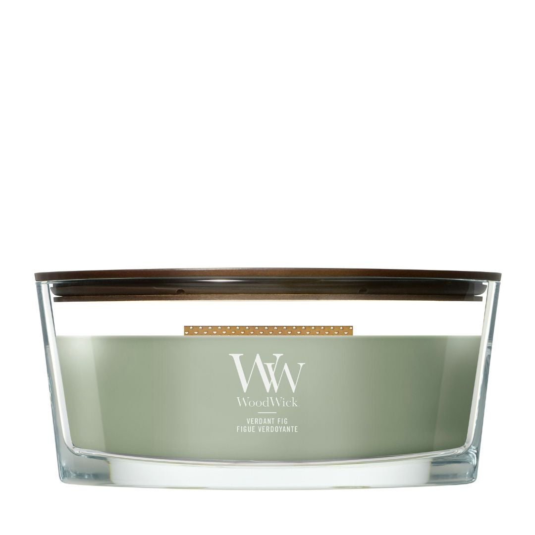 Candela WoodWick Verdant Fig ellipse in vaso di vetro con coperchio in legno.