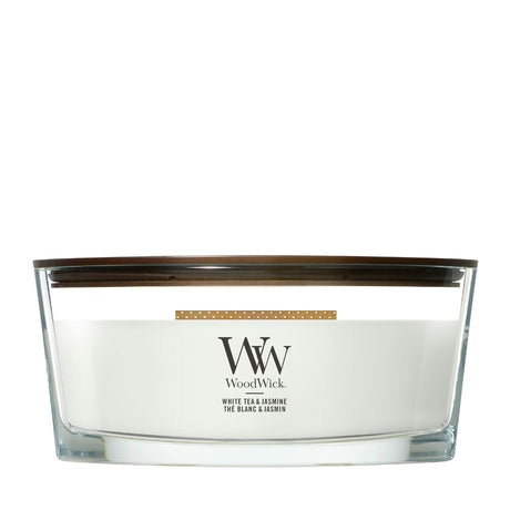 Candela WoodWick White Tea & Jasmine Ellipse in vaso di vetro con coperchio in legno.