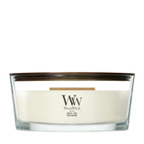Candela WoodWick White Teak Ellipse in vaso di vetro con coperchio in legno.