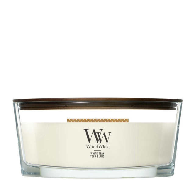 Candela WoodWick White Teak Ellipse in vaso di vetro con coperchio in legno.