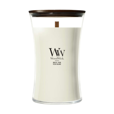 Candela WoodWick White Teak grande in vaso di vetro con coperchio in legno.