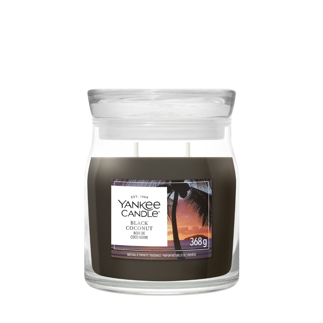 Candela Yankee Candle Black Coconut media in giara di vetro.