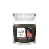 Candela Yankee Candle Black Coconut media in giara di vetro.