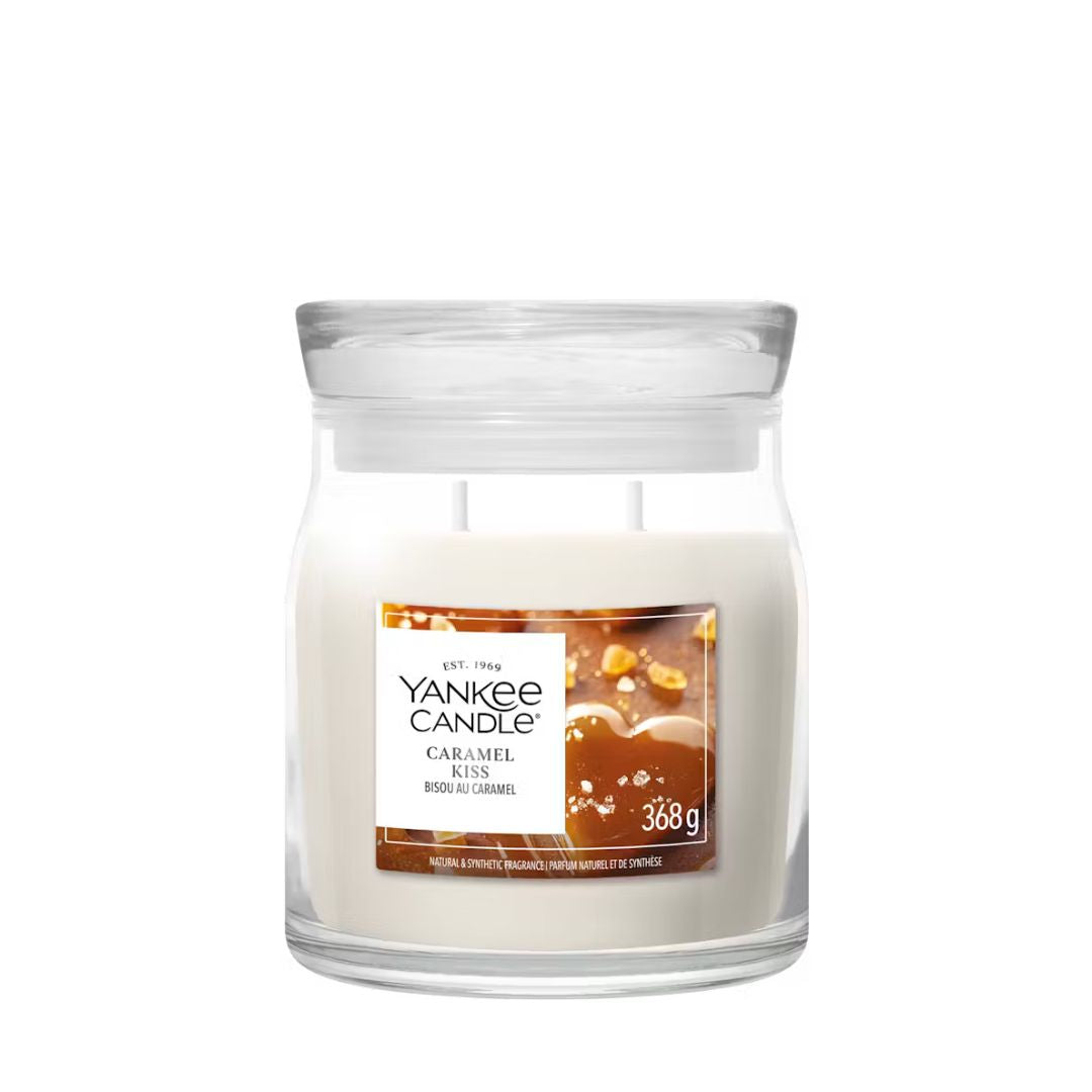 Candela Yankee Candle Caramel Kiss media in giara di vetro.