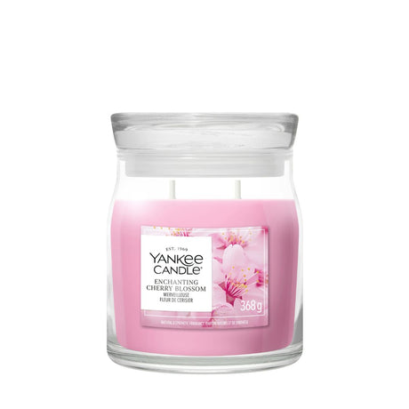 Candela Yankee Candle Enchanting Cherry Blossoms media in giara di vetro.
