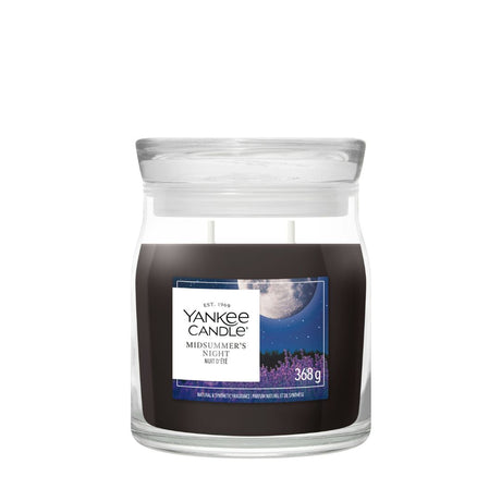 Candela Yankee Candle Midsummer’s Night media in giara di vetro.