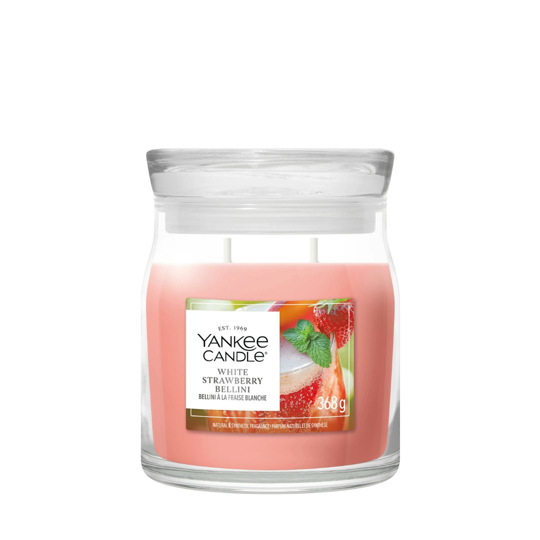 Candela Yankee Candle White Strawberry Bellini media in giara di vetro.