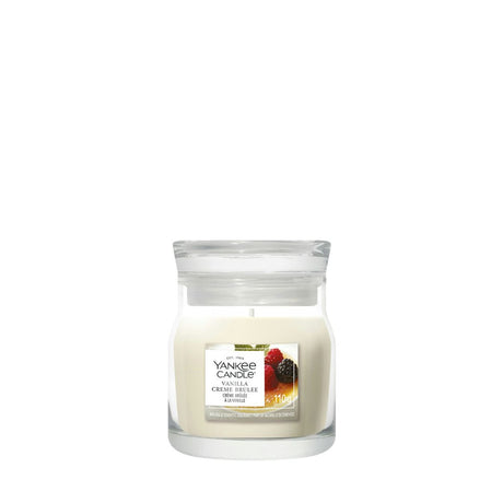 Candela Yankee Candle Vanilla Crème Brûlée piccola in giara di vetro.