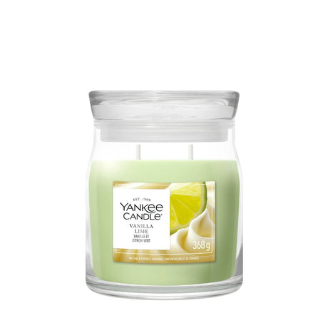 Candela Yankee Candle Vanilla Lime media in giara di vetro.