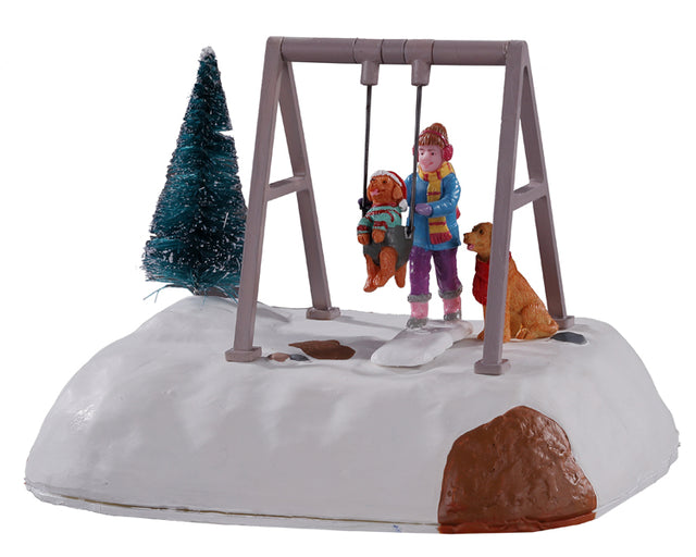 Puppy Gets a Swing Ride 14836 - Scena natalizia in cui una bambina spinge un cagnolino sull'altalena.